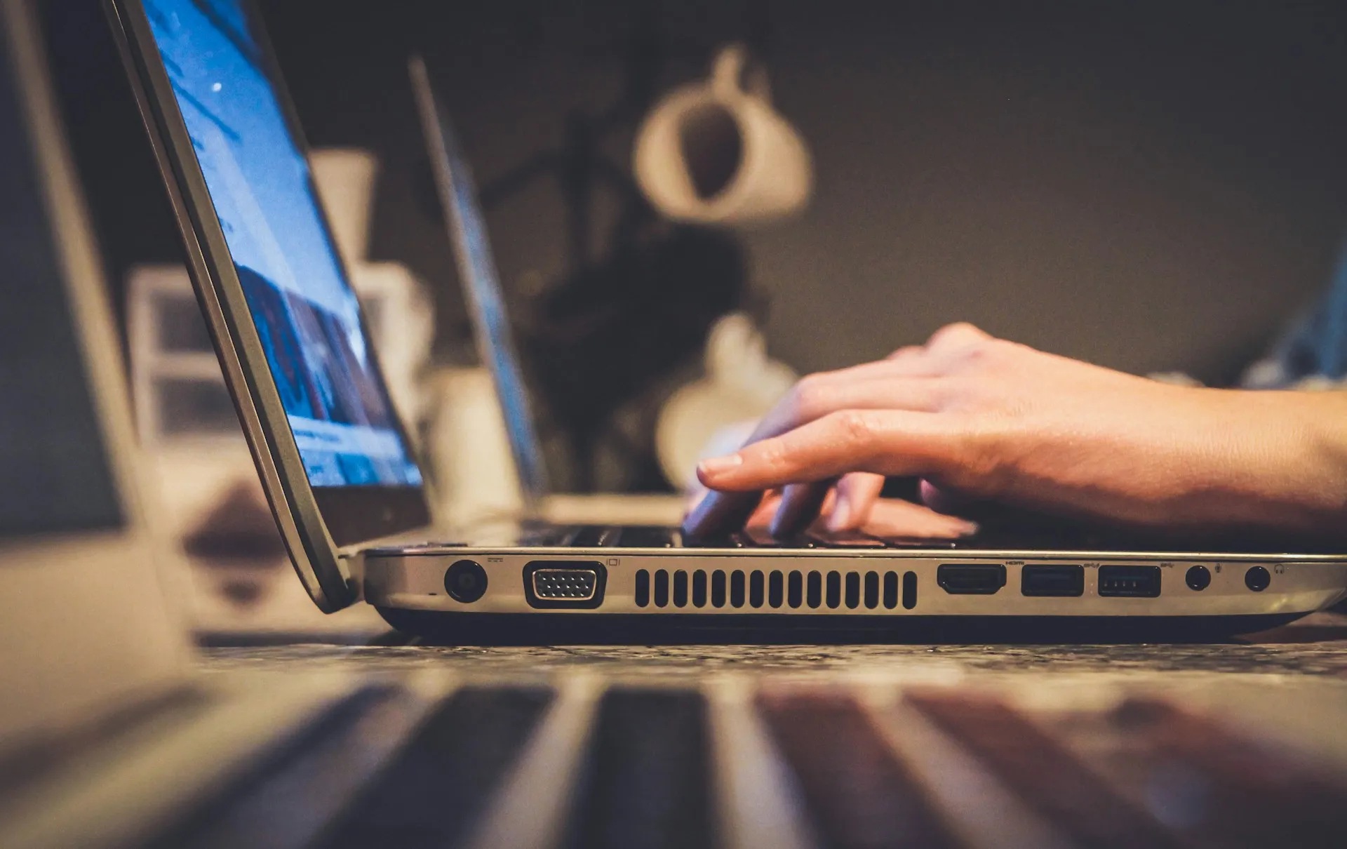 Person using silver laptop